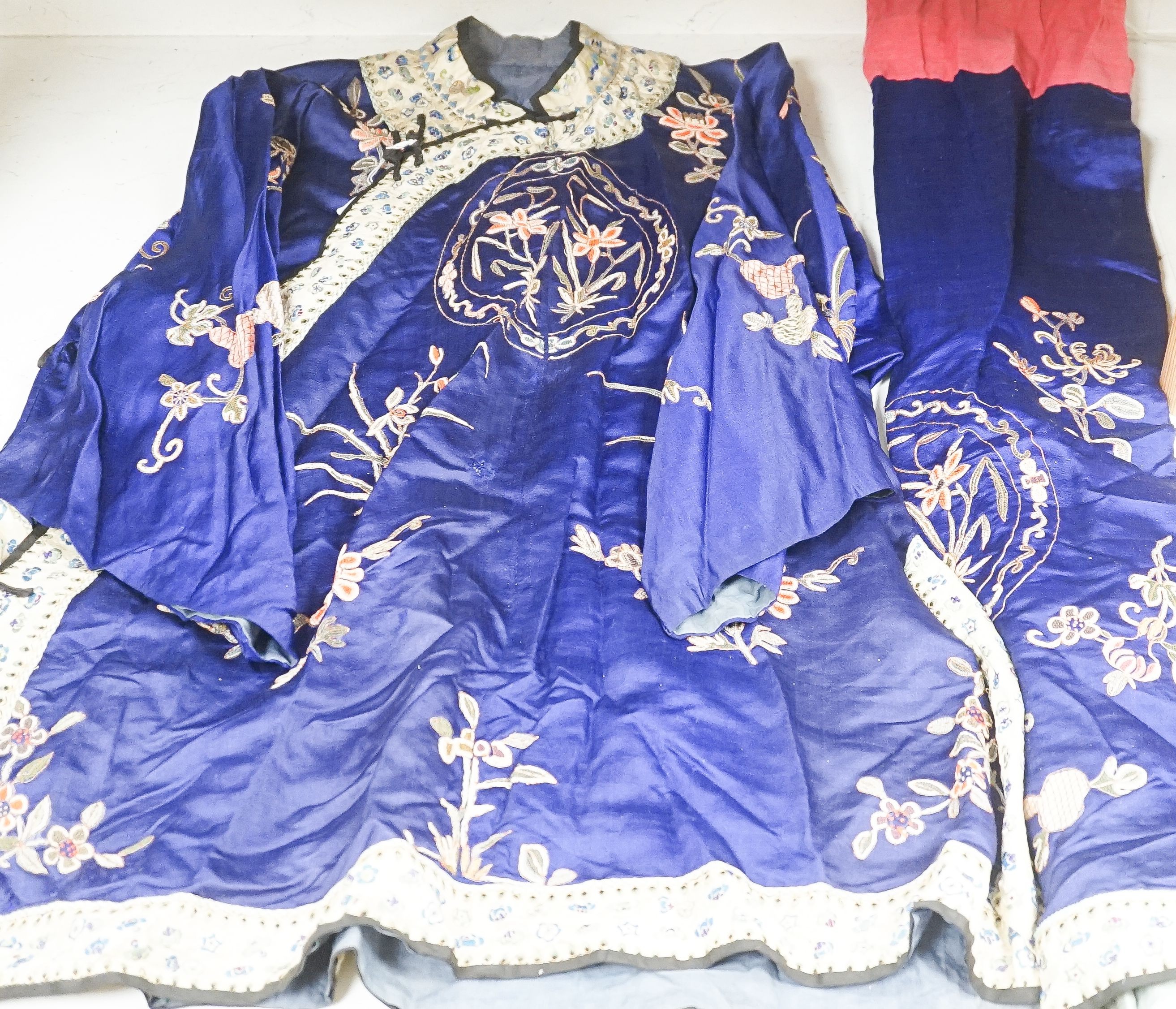 A Chinese embroidered silk robe and a matching pair of trousers